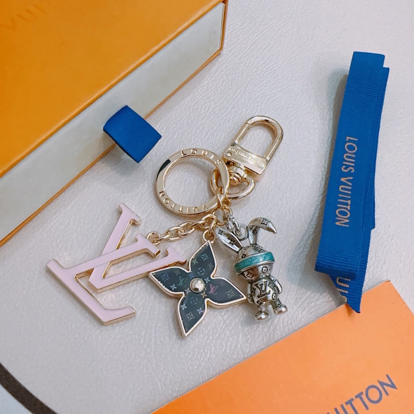 Louis Vuitton Monogram Keychain with LV Logo and Mice Charm Louis Vuitton Monogram Keychain with LV Logo and Mice Charm